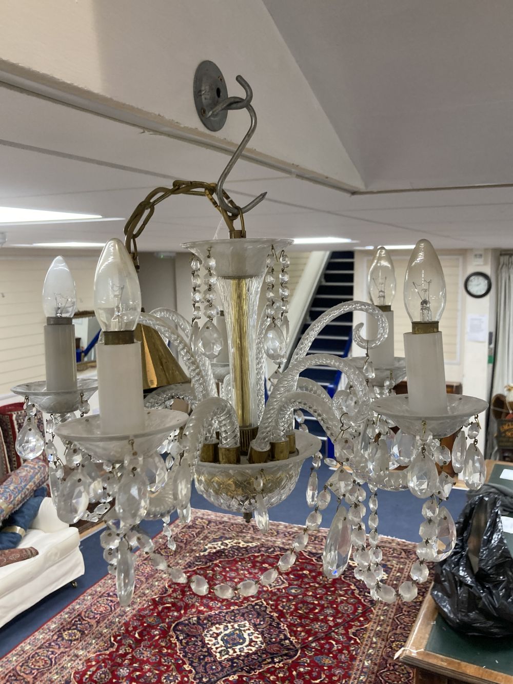 A pair of five branch Venetian glass chandeliers, each with cut lustre drops and another similar